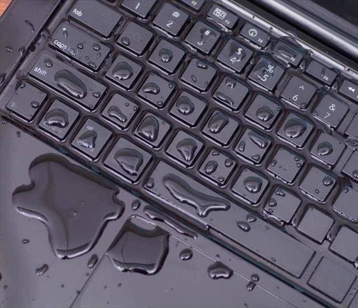 Water on keyboard of laptop 
