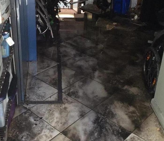 Soot covered floor in a business establishment.